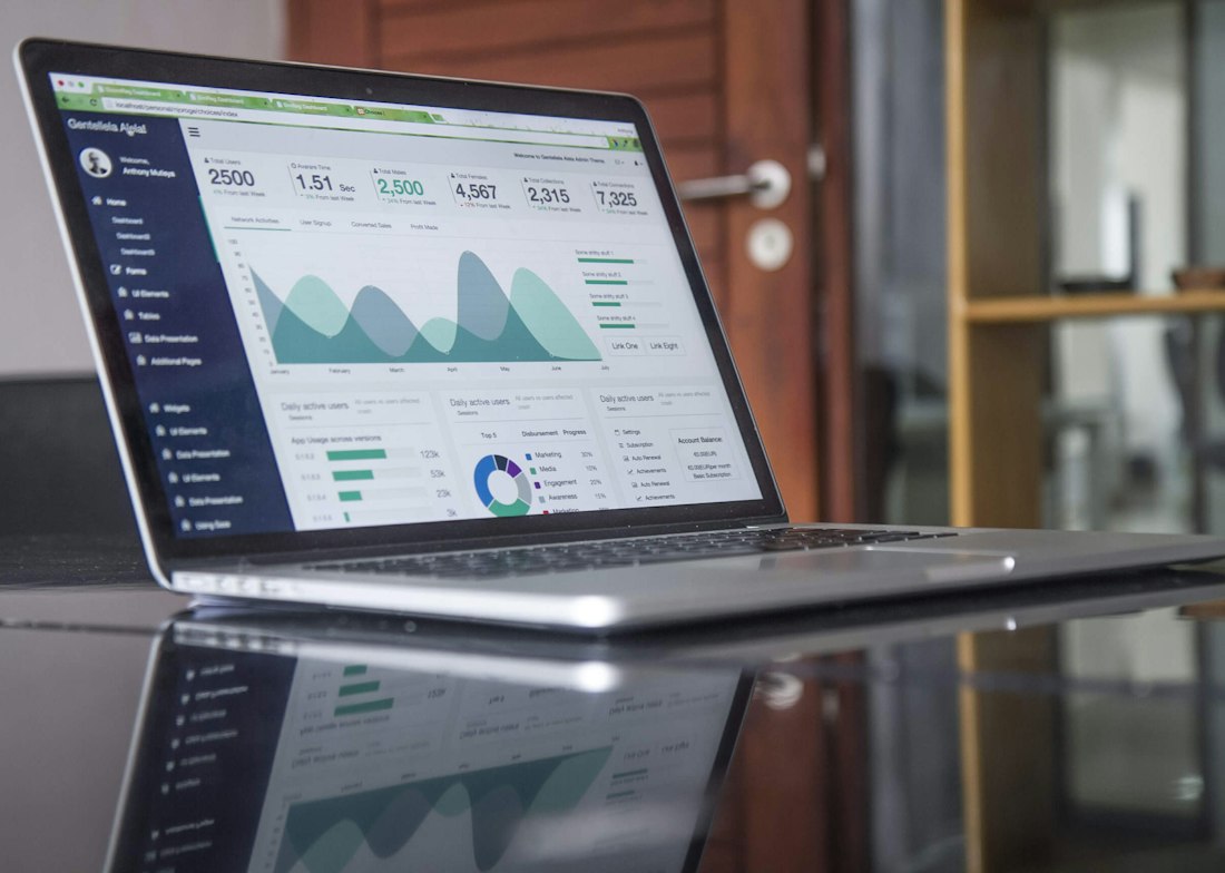 Charts and marketing analysis on a laptop screen